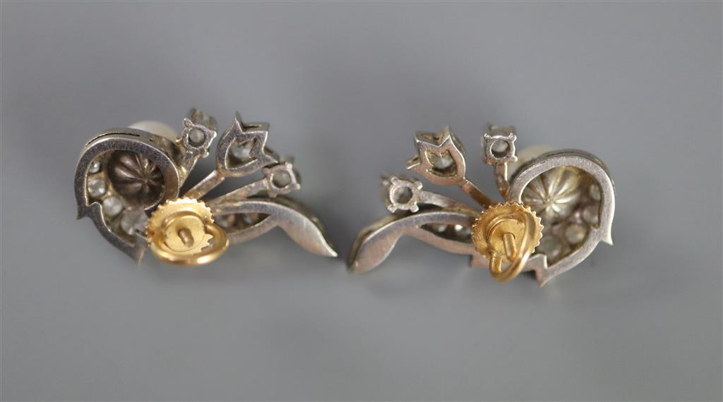 A pair of white gold, cultured pearl and diamond cluster set scroll earrings,